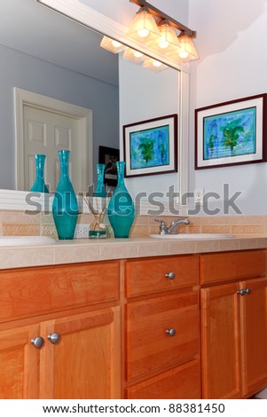 Blue bathroom with sink wood cabinet