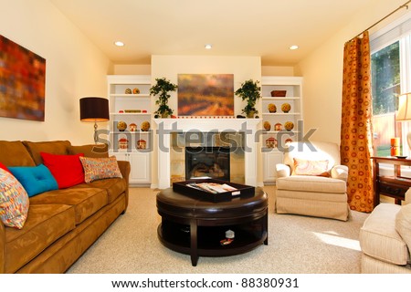 Cozy furnished living room with sofa and fireplace
