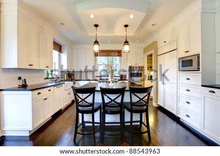 White large luxury modern kitchen with dark floor