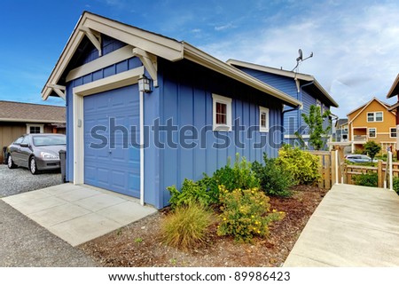 Detached garage of the blue house.