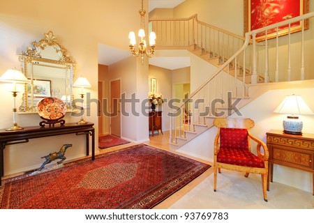 Beautiful elegant entrance, living room and stair case.