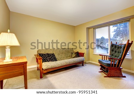 Guest bedroom with desk and chair.