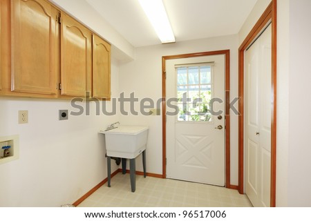 White Simple Laundry Room With Sink And Cabinets. Stock Photo ...