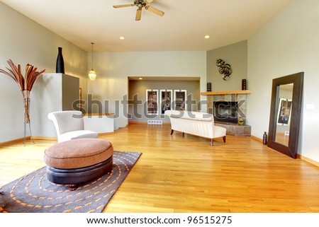 Fantastic modern living room home interior. Huge green bright room with modern furniture.