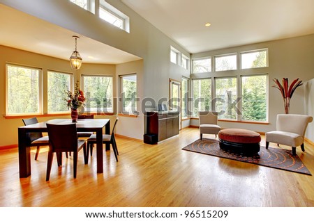 Fantastic modern living room home interior. Dining room. Huge green bright room with modern furniture.