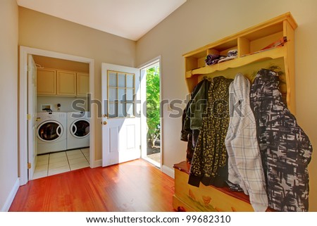 Laundry room with mud room and clothes.