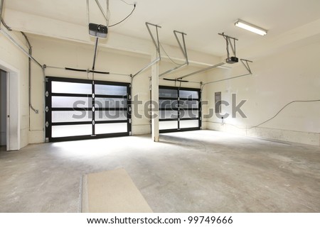 Modern two cars garage with glass doors.