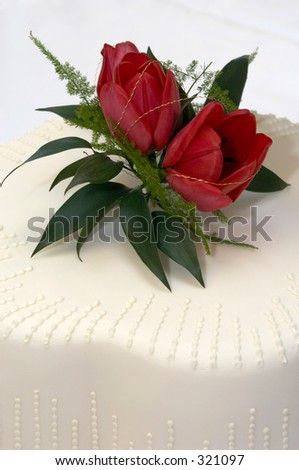 stock photo red tulips decorating a wedding cake