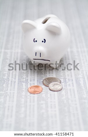 Sad Piggy Bank With Change On The Stock Page