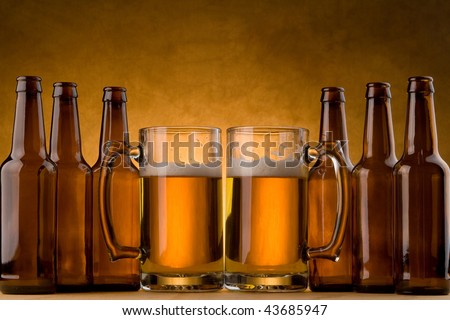 Six pack of beer bottles and beer mugs