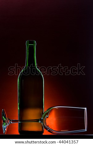 Empty wine bottle with wine glass