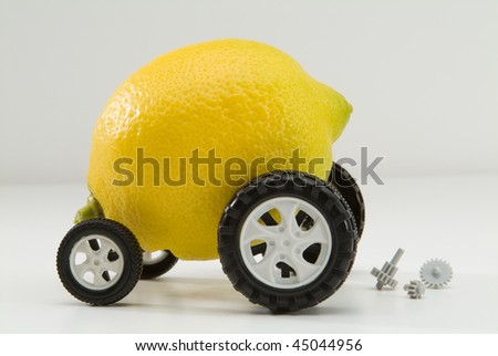 Broken down Lemon with wheels and car parts