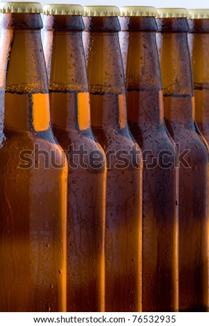 Close up of six cold bottled beers