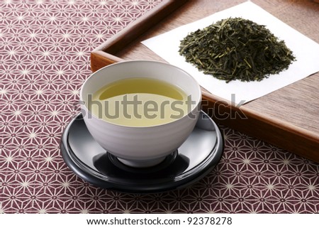 japanese  tea leaves and hot green tea