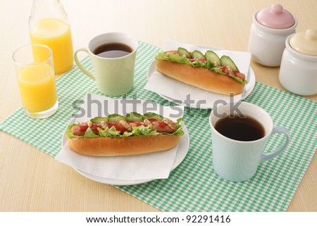 hot dogs, hot coffee and orange juice