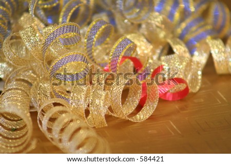 golden and blue curly loops from a ribbon bow