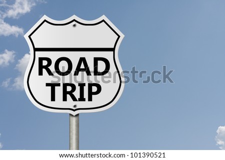 An American interstate road sign with words Road Trip with sky background, Taking a Road Trip