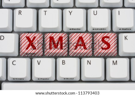 A computer keyboard with keys spelling Xmas, Shopping for Christmas on the internet