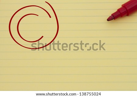 Yellow Lined Paper with the grade C in red circled and a marker, Getting an average grade