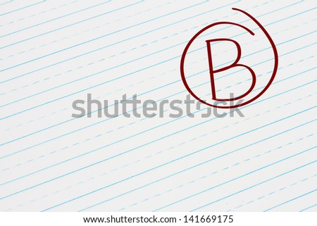 Blue Lined Paper with the grade B in red circled, Getting the grade