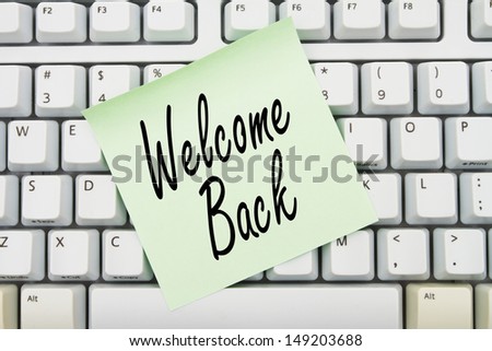 Computer keyboard keys with sticky note with words Welcome Back, Welcome back to our website