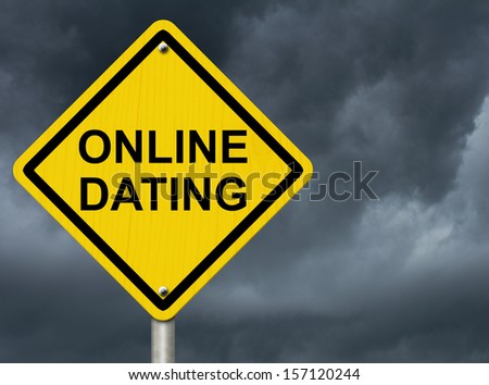 A road warning sign against a stormy sky with words Online Dating, Warning about Online Dating
