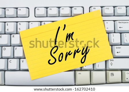 Computer keyboard keys with index card with words I\'m Sorry, I\'m Sorry