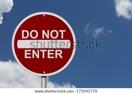 Do Not Enter Sign, A Round American road warning sign with words Do Not Enter with blue sky