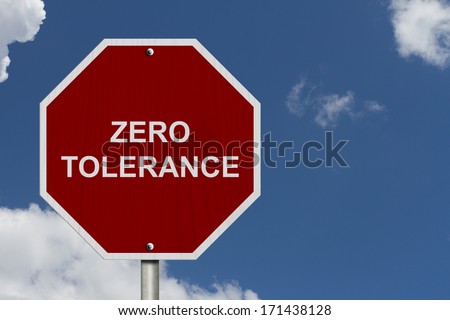 Zero Tolerance Sign, An American road warning sign with words Zero Tolerance with blue sky