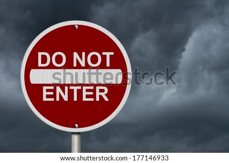 Do Not Enter Sign, A Round American road warning sign with words Do Not Enter with stormy sky