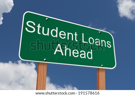 Student Loans Ahead Sign, Green highway sign with words Student Loans Ahead with blue sky background