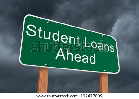 Student Loans Ahead Sign, Green highway sign with words Student Loans Ahead with stormy sky background