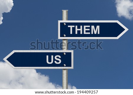 Blue street signs with blue sky with words Us and Them, Us versus Them