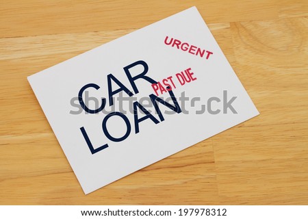 Car Loan Payment Past Due envelop with past due and urgent stamps on a wooden desk