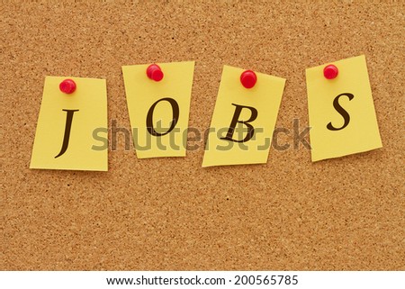 Jobs board, Four yellow notes on a cork board with the word Jobs