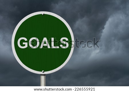 Goals Sign, An green road sign with text Goals with stormy sky background