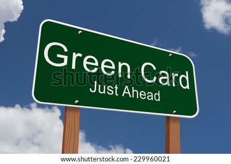 Green Card Just Ahead Sign, Green highway sign with words Green Card Just Ahead with sky background