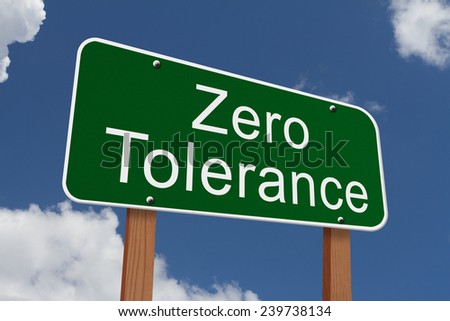 Zero Tolerance Sign, Green highway sign with words Zero Tolerance with sky background