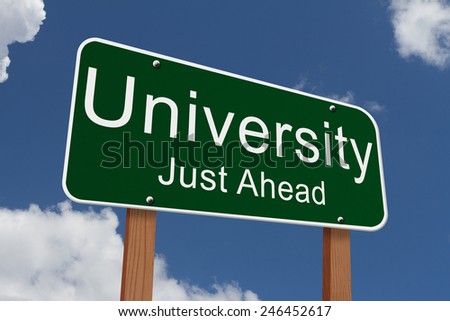 University Just Ahead Sign, Green highway sign with words University Just Ahead with sky background