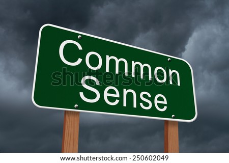 Common Sense Sign, Green highway sign with words Common Sense with stormy sky background
