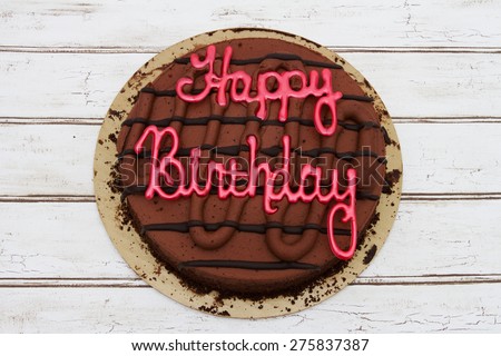 Happy Birthday Cake, A Chocolate Happy Birthday Cake over a distressed wood background