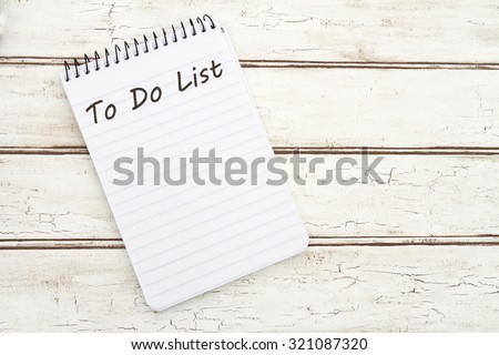 Writing Your To Do List, A spiral Notepad that has the words To Do List over a distressed wood background