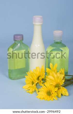 Spa beauty kit - bottles of lotions with flowers