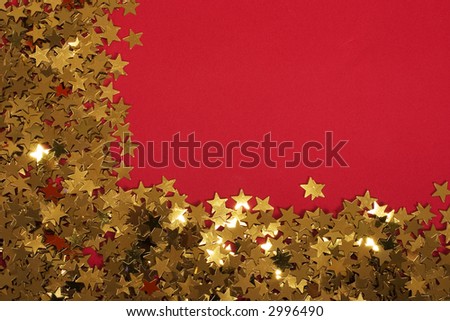 Gold stars glittering on a red background