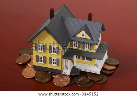 Two-story house with red wooden background and pennies