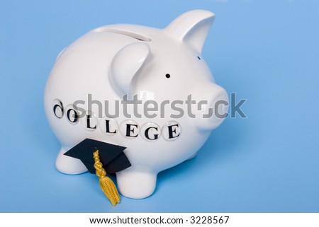 Saving for college - piggy bank with grad cap