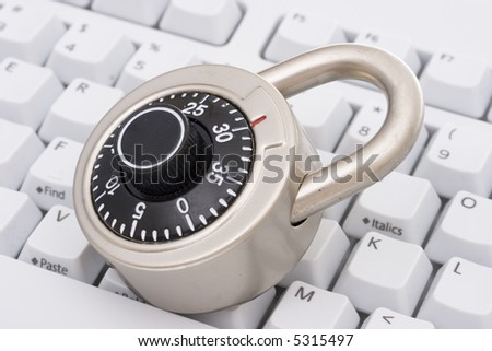 A black combination lock on a keyboard