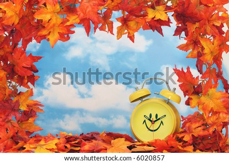 Fall leaf border with clock, sky background