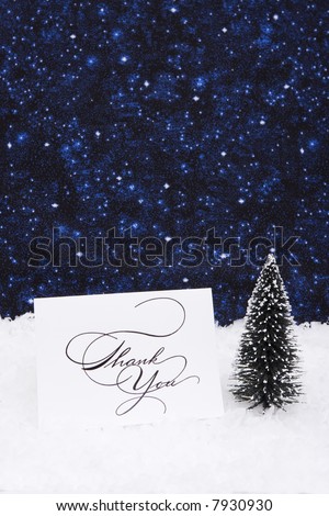 Thank you card on snow with tree with copy space
