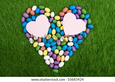 Easter eggs in heart shape with two blank hearts